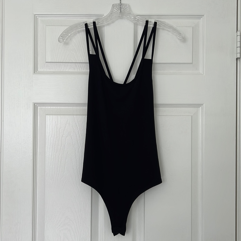 Black cross-cross back, spaghetti straps, thong bodysuit.